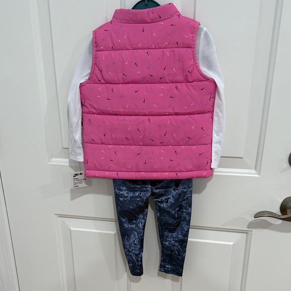 Nike Pink Puffer Vest with White Shirt and Blue Leggings - Picture 7 of 7